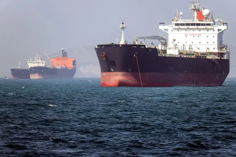 A massive oil droplet pins a cracked globe as fractured shipping paths circle the surface.
