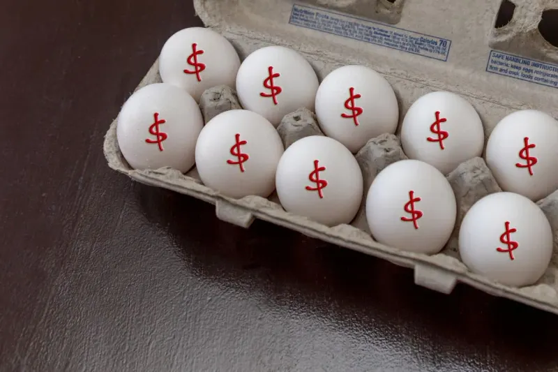 A golden nest egg balances on a thirty-link chain, symbolizing hidden risk in a long Treasury bond.