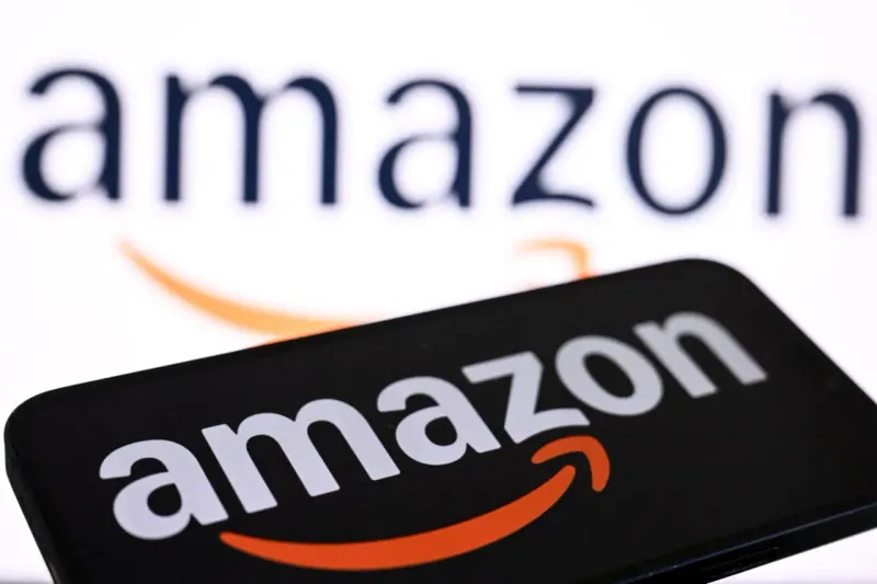 Editorial illustration for: Amazon’s stock slips as the FTC alleges billions of dollars in hidden ad fees
