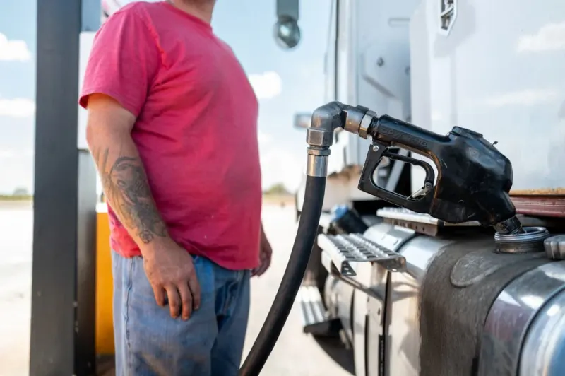 A tightened fuel valve drains supply while a gauge rises, symbolizing higher prices from an export ban.