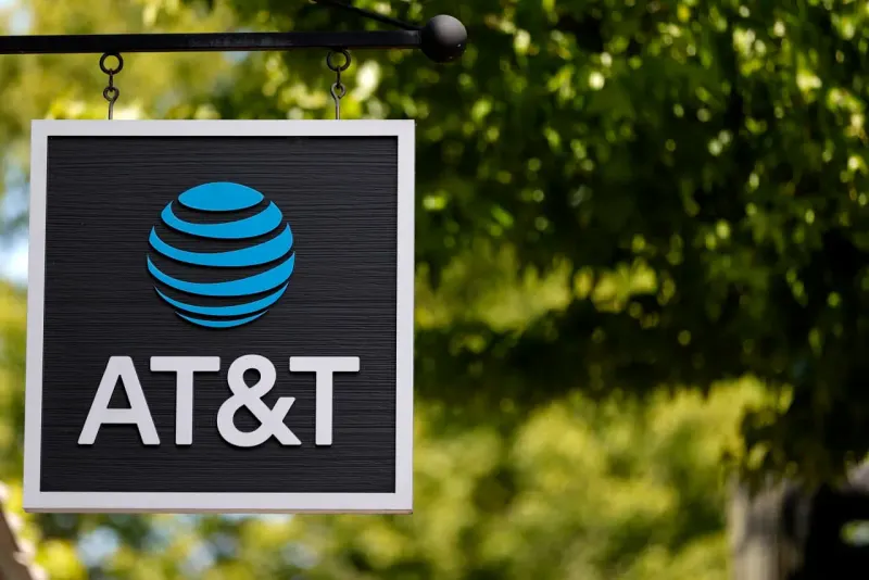 A fiber-optic bridge rises above a satellite shadow, symbolizing AT&T’s subscriber gains despite SpaceX fears.