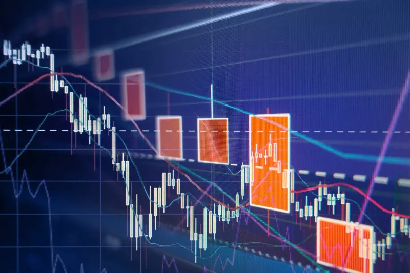 Two market gauge needles converge on a crack, symbolizing bond anxiety and falling financial stocks.