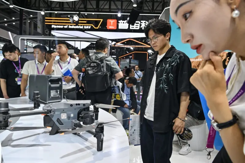 Cameras, drones and tents circle a stalled red engine, symbolizing rentals slowing China’s spending push.