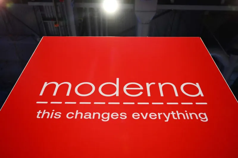 An inflated syringe-shaped balloon tethered to two small coins symbolizes Moderna’s valuation concerns.