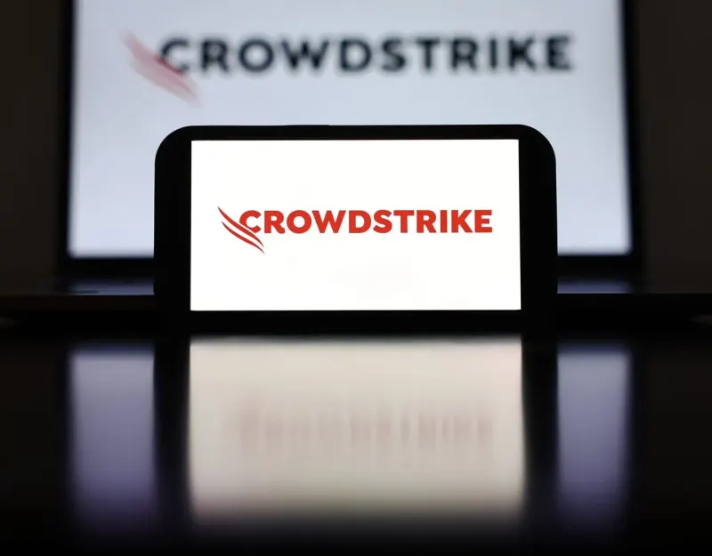 A steel shield breaks through a glass ceiling, symbolizing CrowdStrike’s record results and rising targets.
