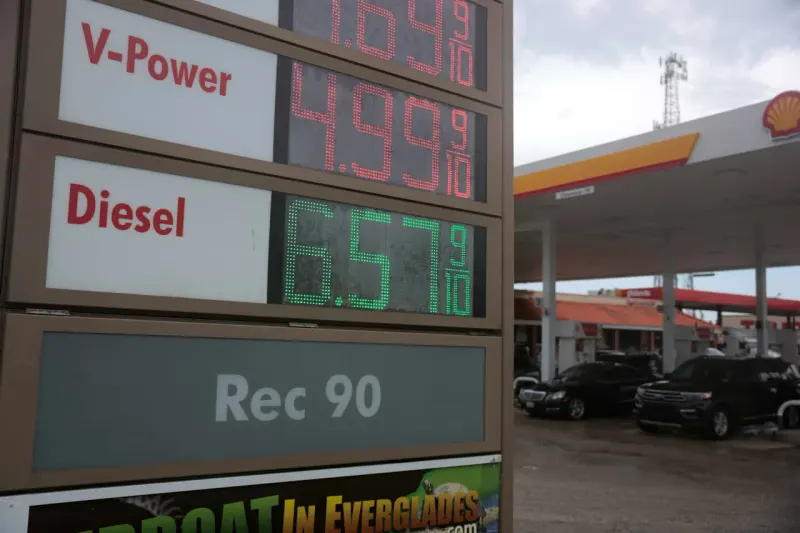 A diesel nozzle shaped like a boomerang returns toward an overheated gauge, symbolizing a policy that could backfire.