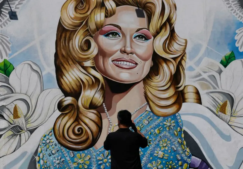 Editorial illustration for: Dolly Parton’s music, books and theme park see spikes in interest following her death