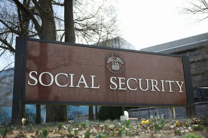 A finance-shaped key approaches a government vault, symbolizing Matt Zames’s unpaid Social Security advisory role.