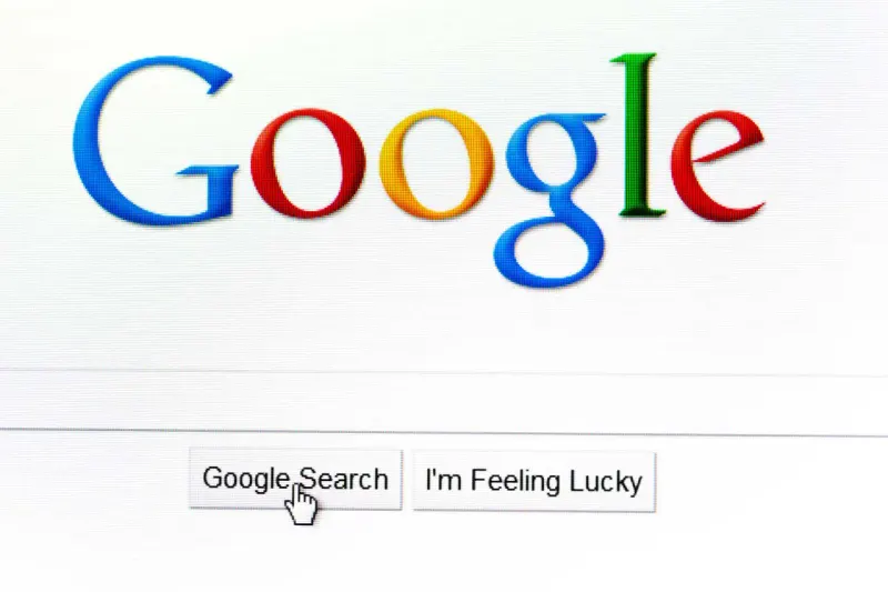 A magnifying glass balances between a glowing neural network and crumbling shards, symbolizing Google’s AI search dilemma.