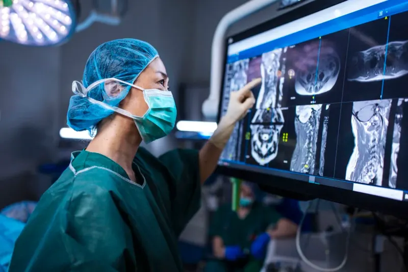 A stethoscope forms a rising arrow whose overheating tip symbolizes healthcare stocks’ powerful but risky rally.
