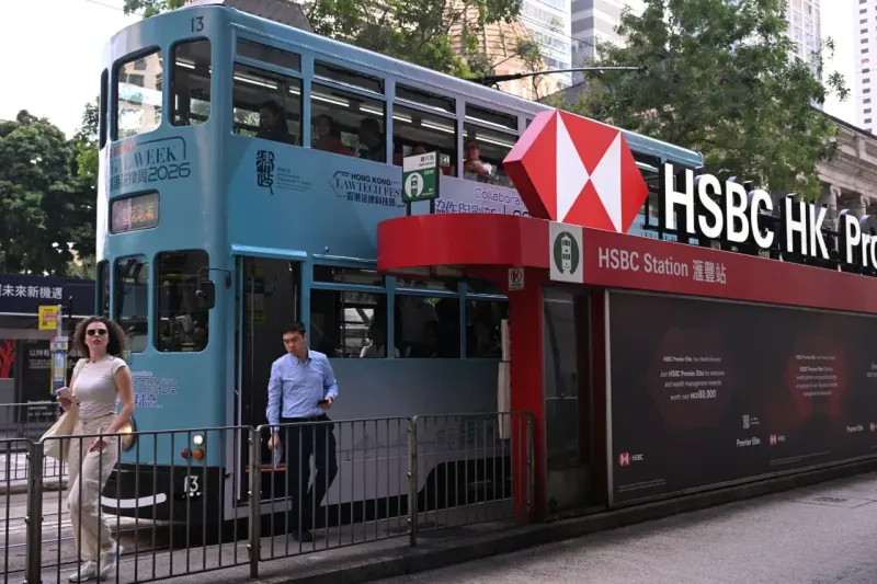 A bank vault leaks coins upward toward a higher rate dial, symbolizing HSBC customers chasing better returns.