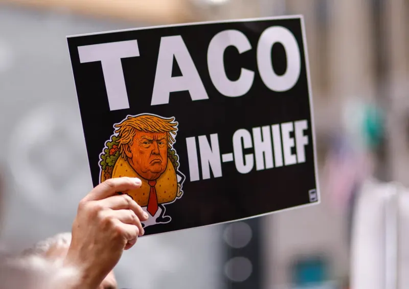 A taco-shaped compass points toward puzzle pieces, symbolizing JPMorgan’s forecast of a Trump deal.