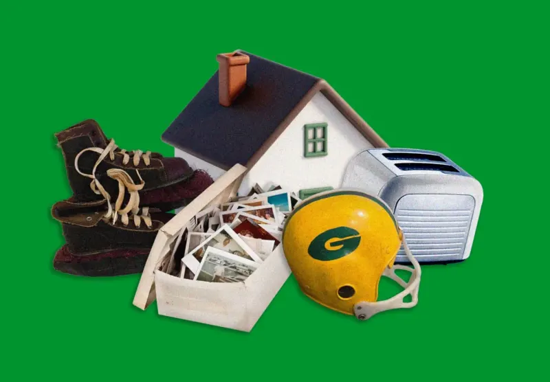 A mountain of possessions dissolves into one photograph, symbolizing memories retained while belongings are released.