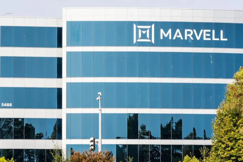 A chip-shaped staircase hits a low ceiling, symbolizing Marvell's higher forecast failing to lift shares.