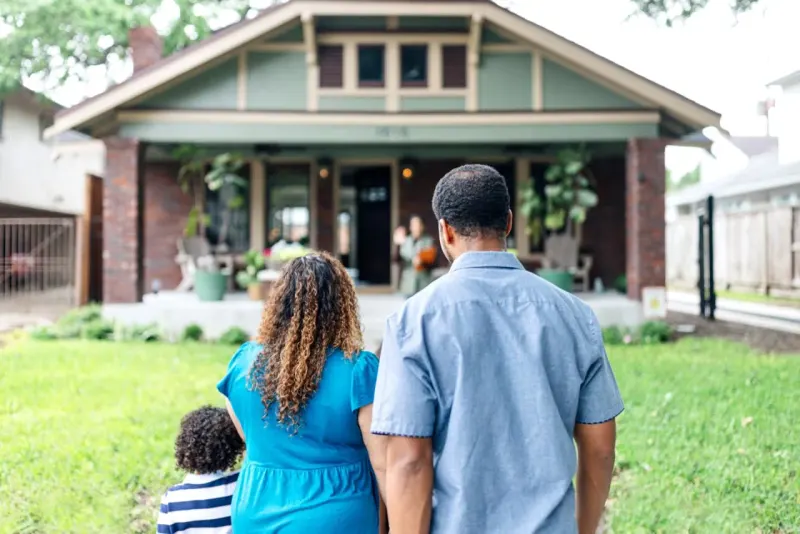 An hourglass balances on symbols of a house, college and a raise, showing how midlife choices shape retirement.