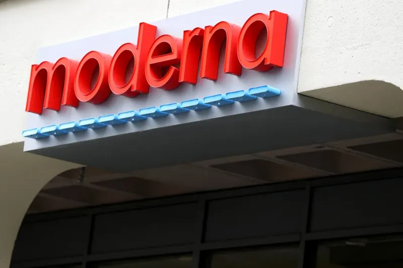 A DNA-shaped balloon deflates near a finish line, symbolizing cooling hopes for Moderna’s cancer vaccine.