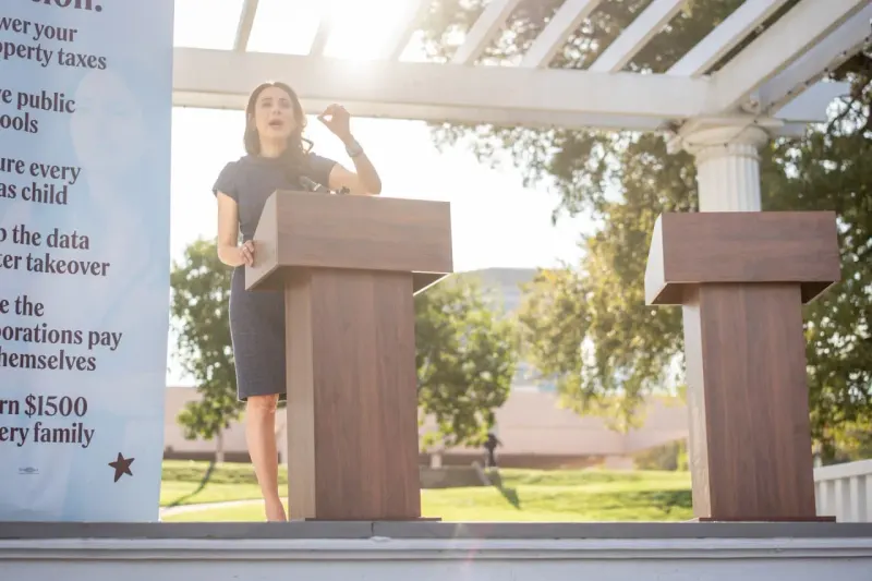 A ballot box acts as a circuit breaker, cutting power to a rising chip-shaped market arrow.