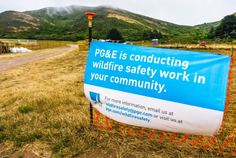 Editorial illustration for: PG&E, other utility stocks sink as California leaves investors exposed to wildfire liability