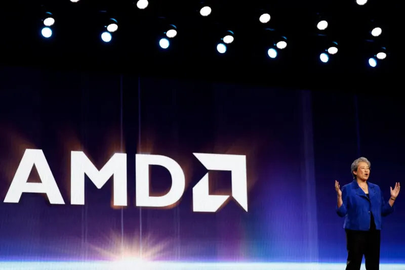 A red processor chip overtakes blue and green rivals on a racetrack curving upward toward profit.