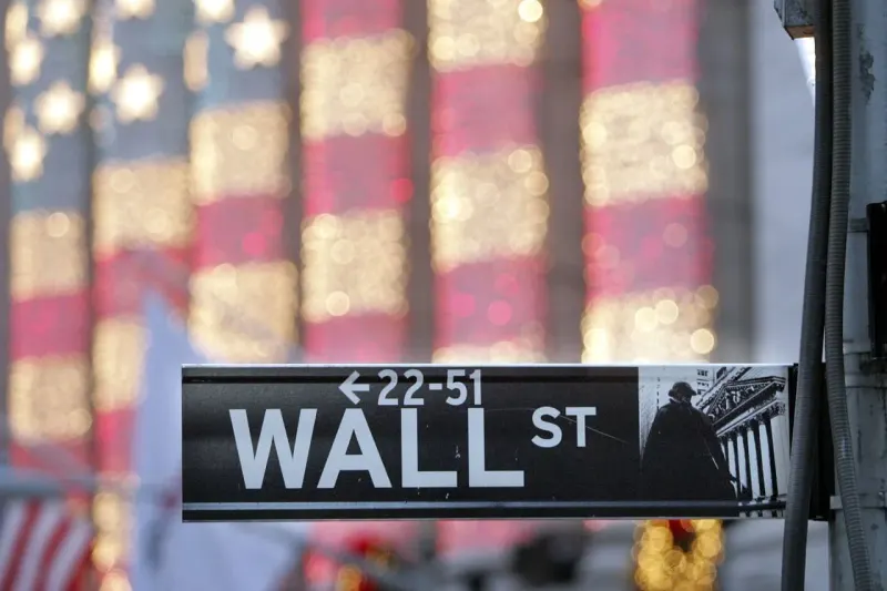 A silicon chip falls on a scale as many smaller blocks rise, symbolizing leadership shifting away from technology.