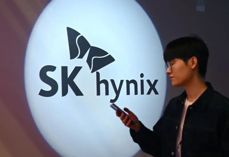 A memory chip pinched inside an hourglass symbolizes SK Hynix supply constraints lasting through 2030.