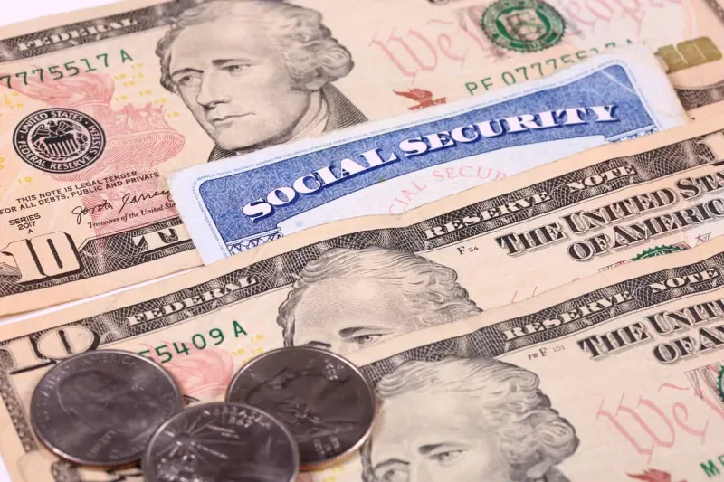 A fraying retirement safety net narrows like an hourglass, symbolizing projected Social Security benefit cuts.