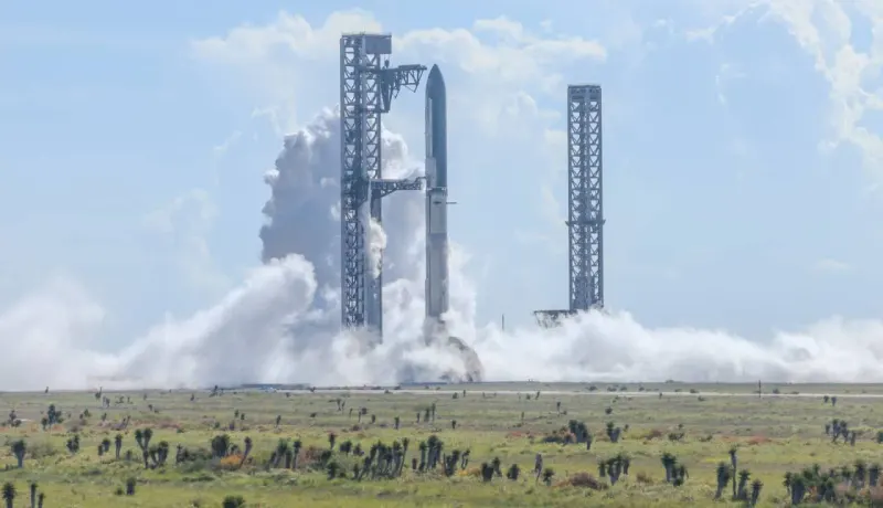 A boomerang shaped rocket arcs toward Earth, symbolizing SpaceX's push for a fully reusable Starship.
