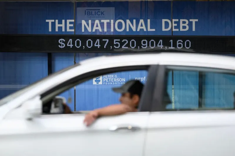 A bond-paper snowball grows on a steep curve, symbolizing compounding interest costs on U.S. debt.