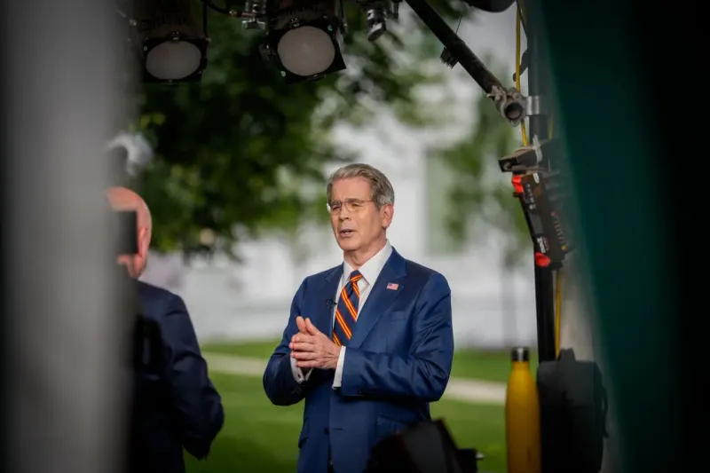 Three megaphones face an unmoved abacus, symbolizing political messaging colliding with bond market arithmetic.