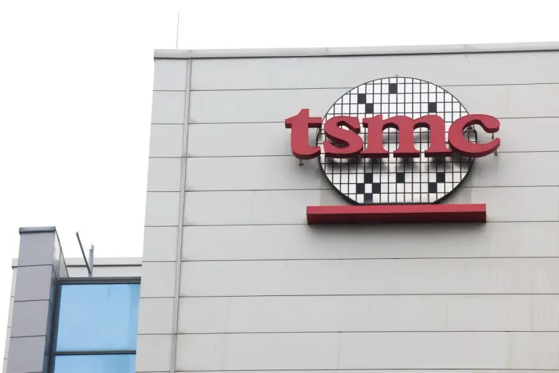 A silicon wafer shaped like a speedometer symbolizes TSMC’s record profit and continued momentum.