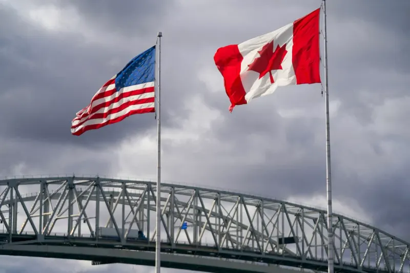 A cracking bridge of maple-leaf and star-shaped links symbolizes worsening U.S.-Canada trade ties.