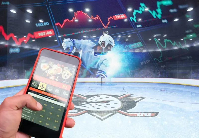 A cracked pie-chart soccer ball made from betting chips symbolizes the proposed convergence of sports wagering and ETFs.