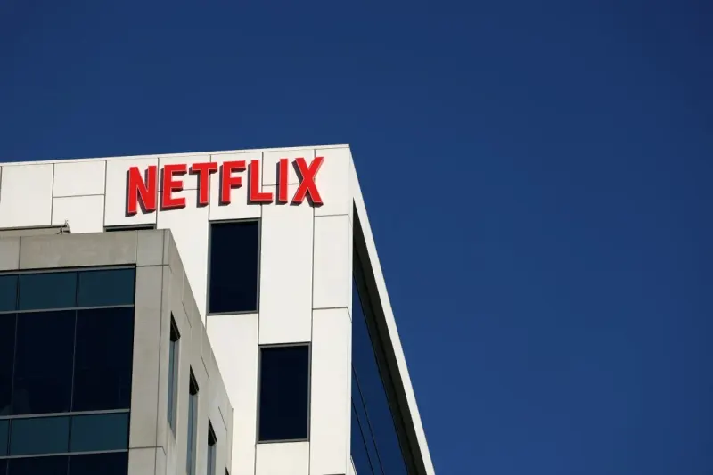 A podcast microphone outweighs a dim film reel as a distant star symbolizes Netflix’s need for breakout shows.