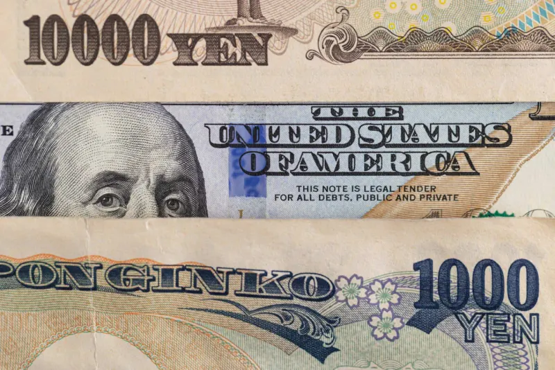 A rising red sun pulls free from an unraveling financial rope as blank bonds fall below.